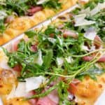 best prosciutto flatbread recipe with arugula feature shot.