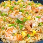 quick and easy shrimp fried rice better than takeout feature image. close up with garnish.