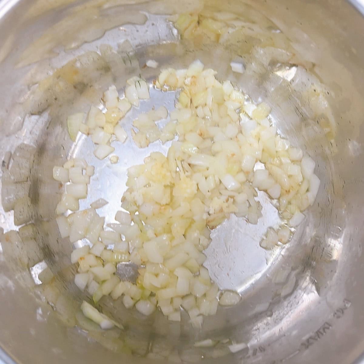 spanakorizo greek spinach rice with lemon and dill process shot 2 sautéing onions and garlic