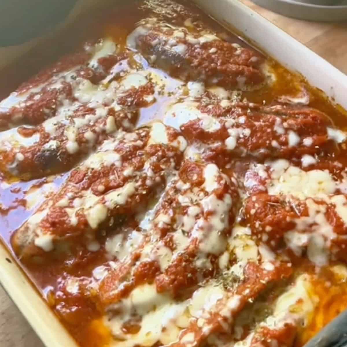 Baked stuffed Italian sausages in marinara sauce with a cheesy finish.