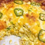 cheesy jalapeno corn casserole easy jiffy recipe feature image baked with scoop removed
