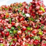 Cranberry salsa with jalapenos in a white serving bowl.