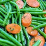 green beans and carrots close up with thyme in buerre fondue sauce feature image