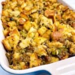 Sourdough stuffing dressing with sausage sage and mushrooms feature image close up in casserole dish
