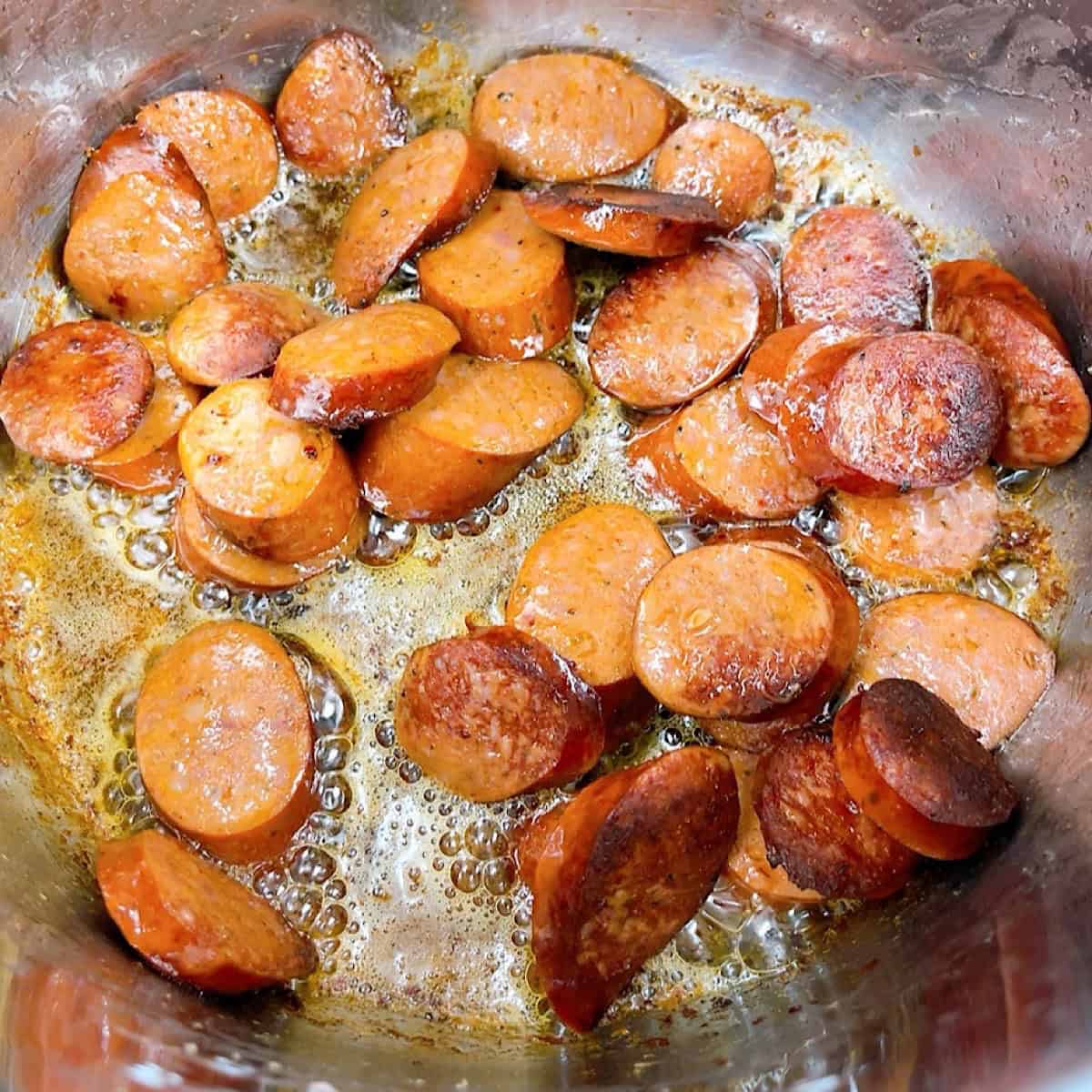 Easy instant pot black eyed peas with sausage and collard greens recipe process shot 2 frying sausage