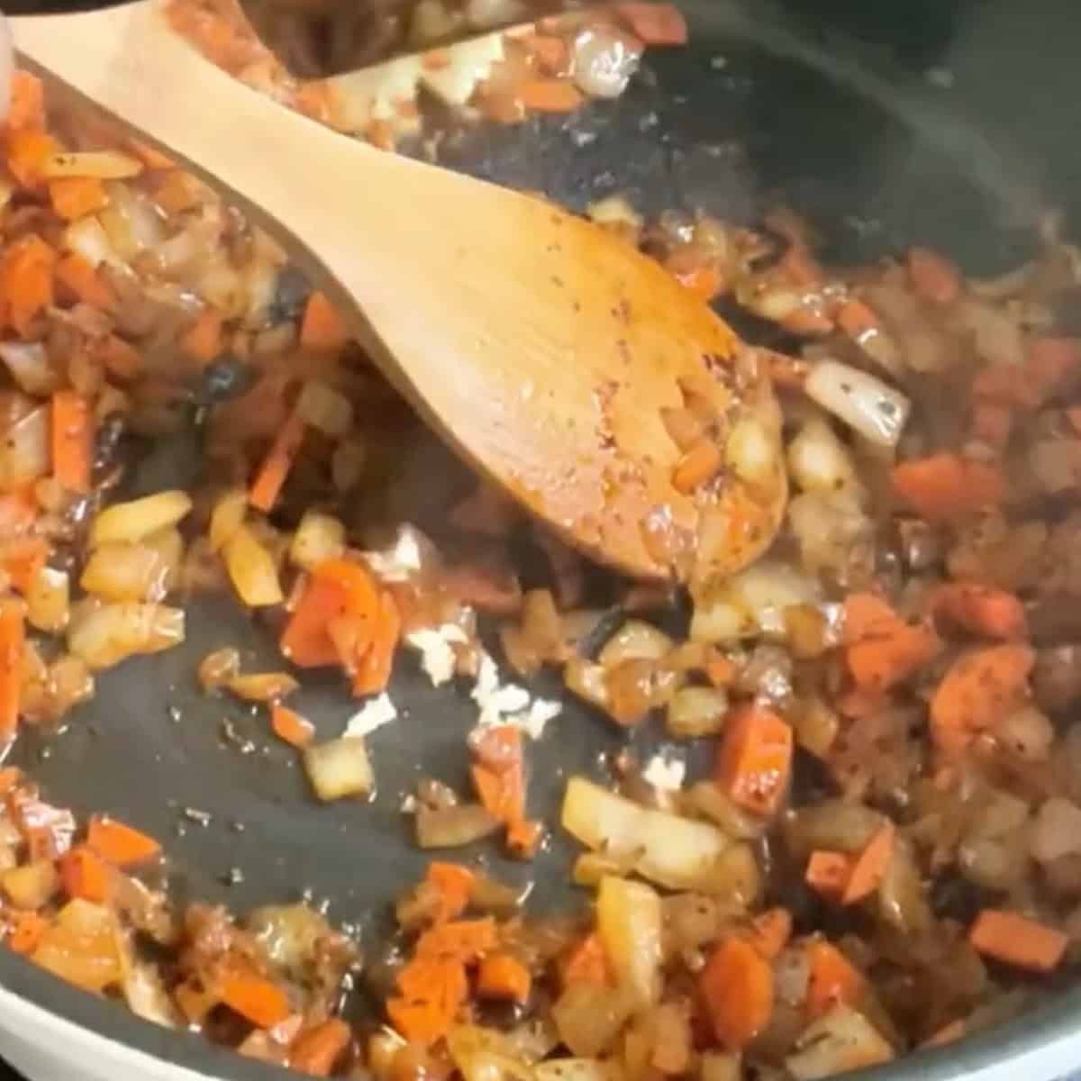 Creamy Tuscan Tortellini Soup process shot 2 sautéing vegetables.