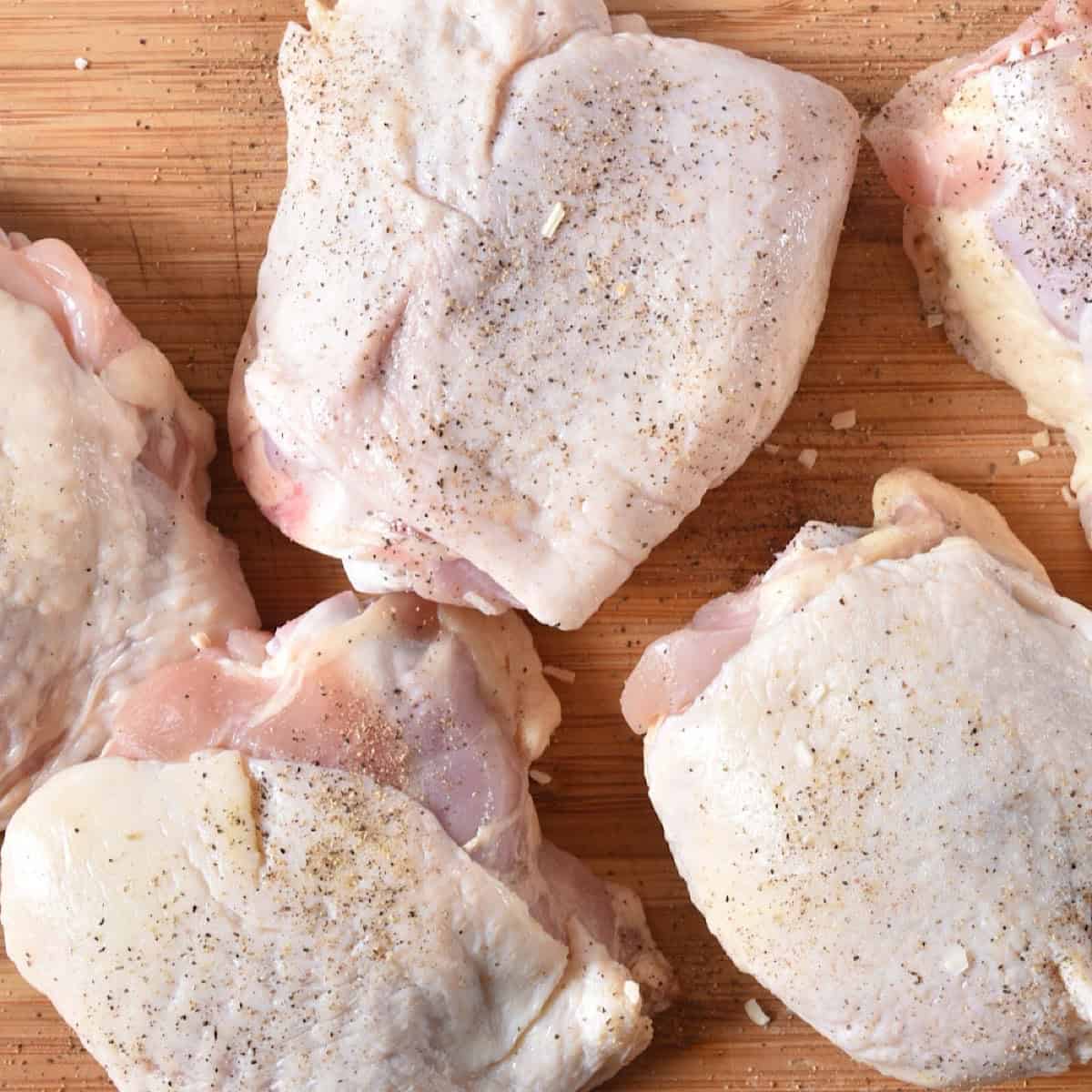 Raw chicken thighs patted dry.