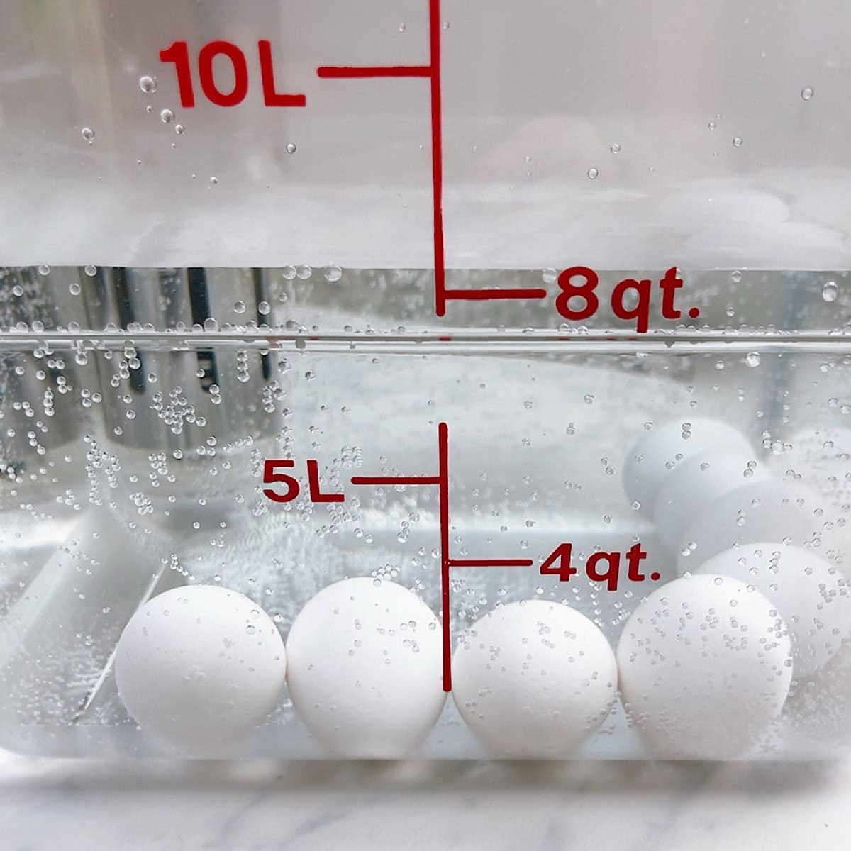 Eight eggs in water bath with sous vide cooker.
