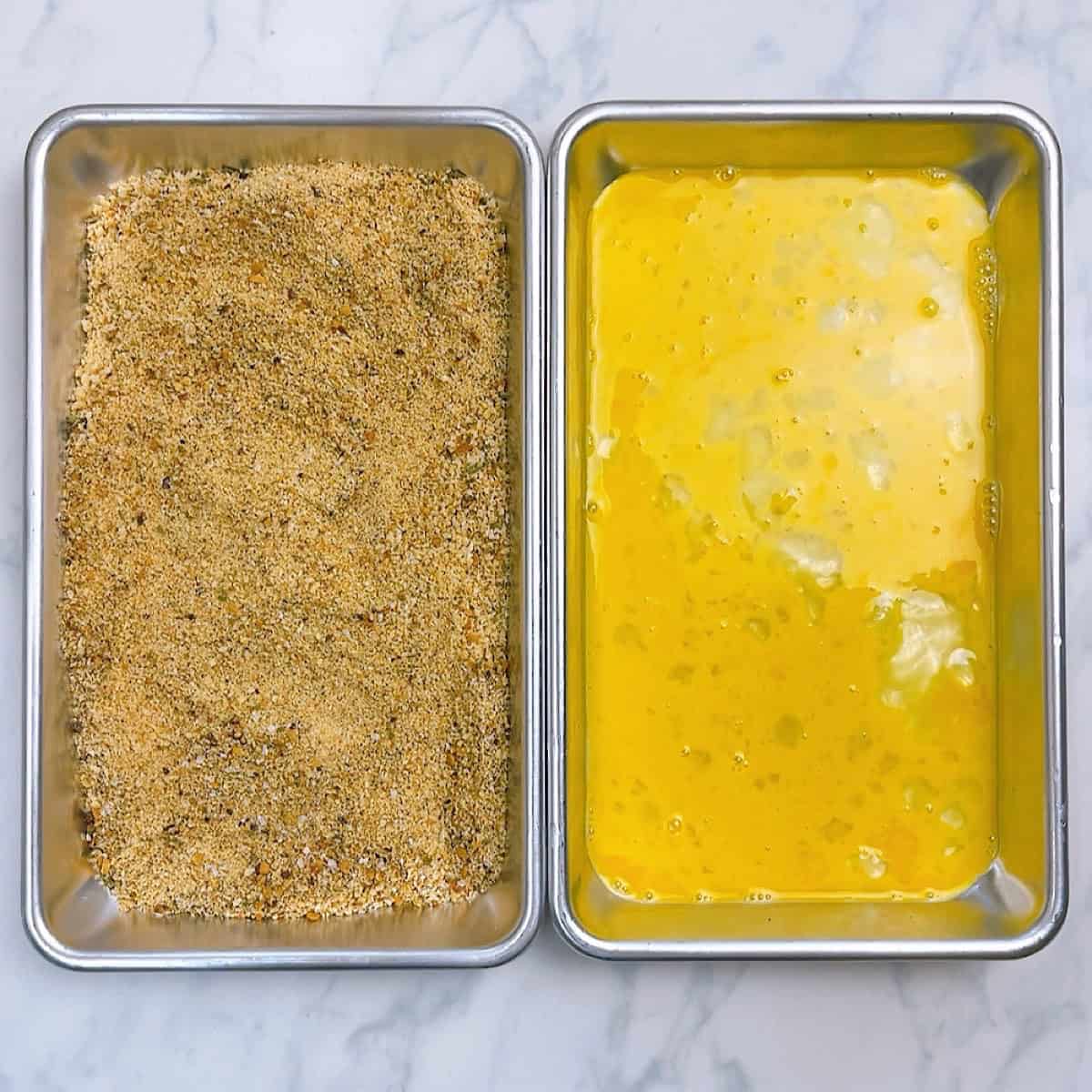 Breading station with eggs and breadcrumbs.