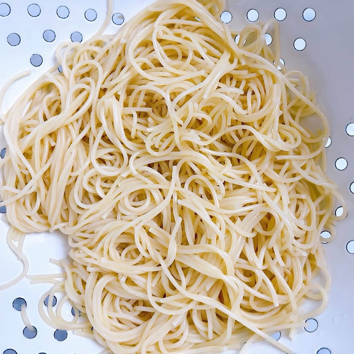 Cooked pasta in a colander.