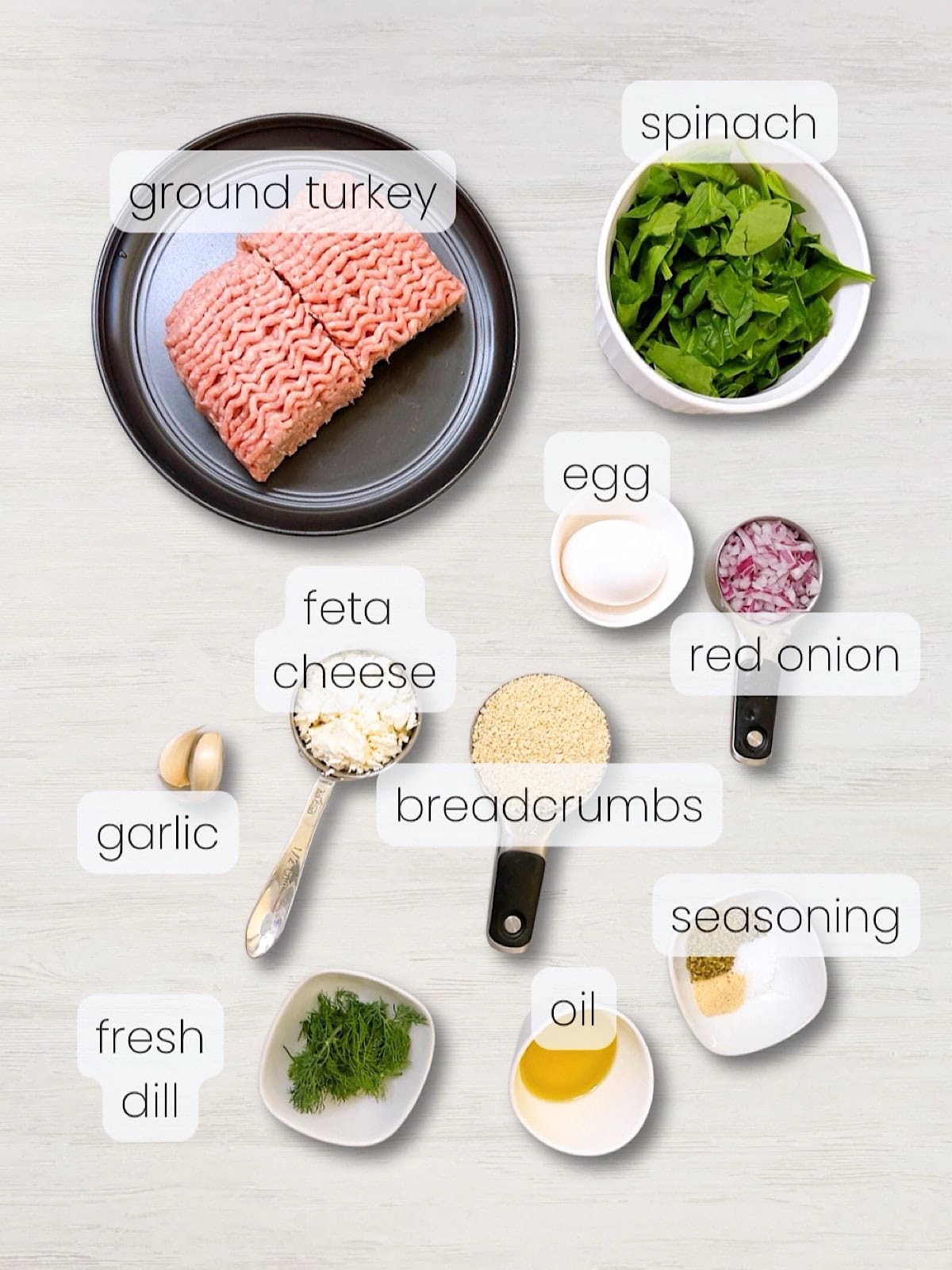 A labeled image of everything needed to make turkey spinach feta burgers.