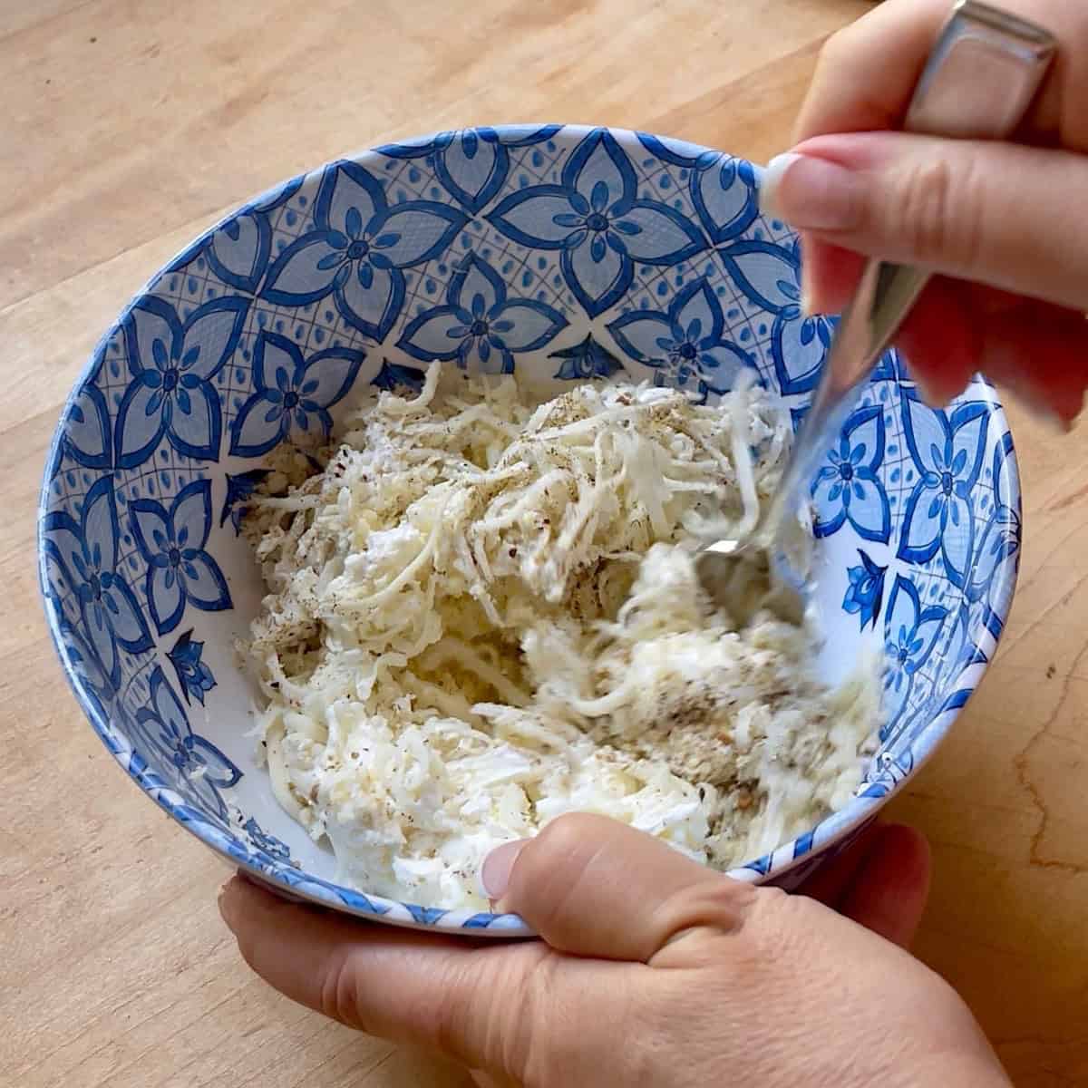 Mixing the cheese filling.