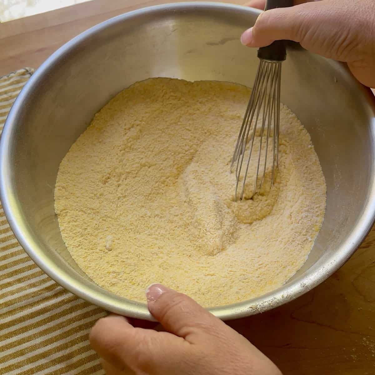 Hoecake dry ingredients whisked in a bowl.