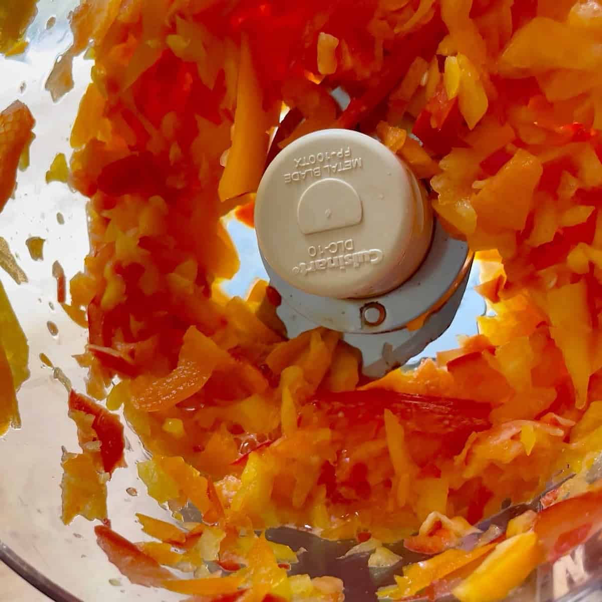 Finely chopping bell peppers in the food processor.