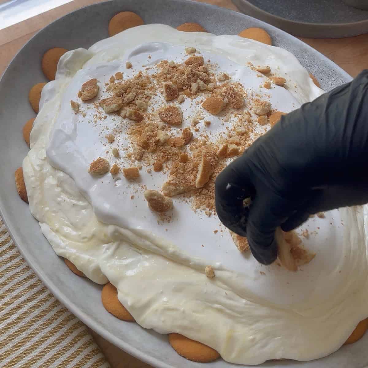 Garnished pudding layered in a dish with Nilla wafers and sliced bananas. 