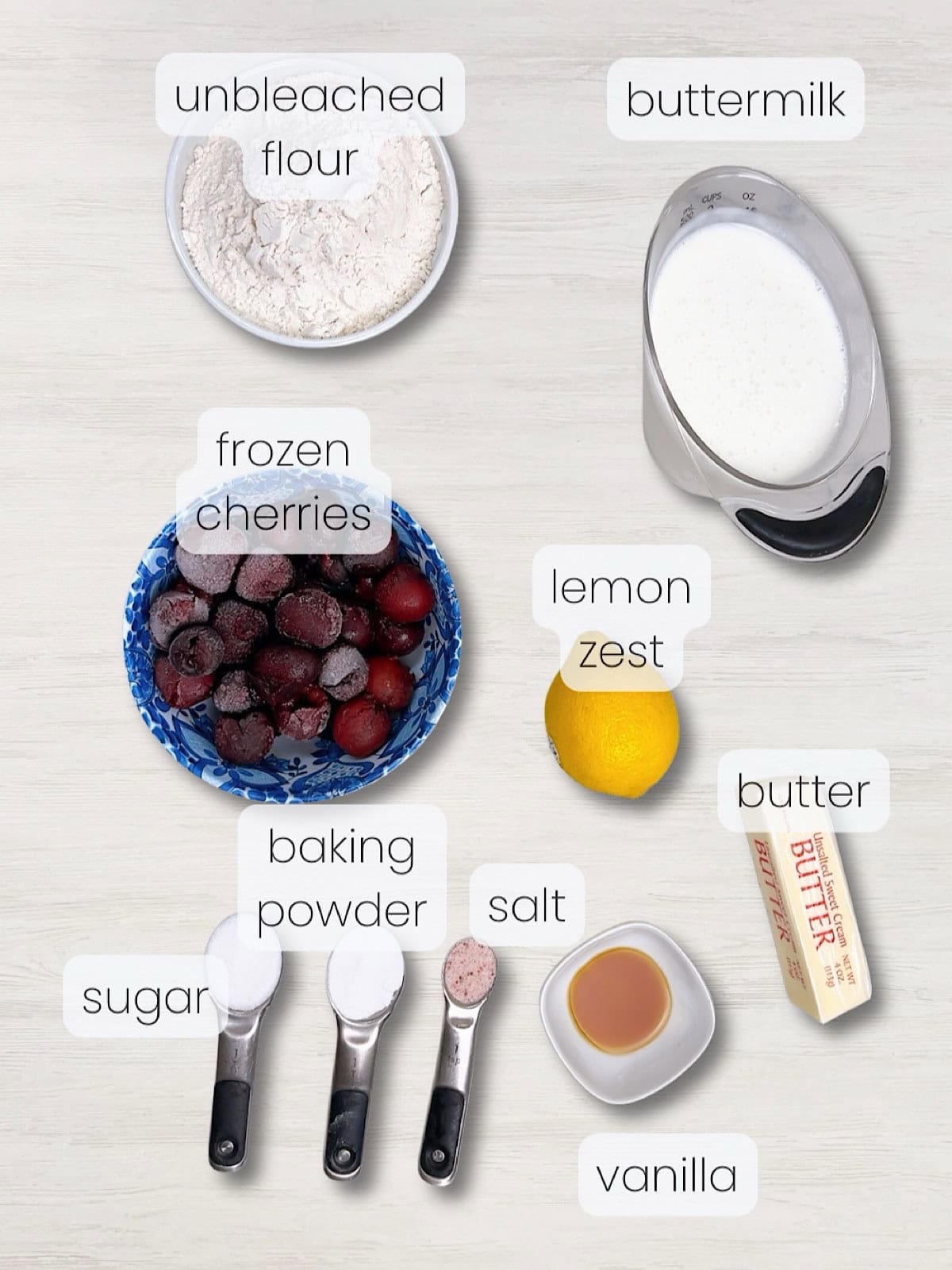 A labeled image of everything needed to make butter swim biscuits with cherries.
