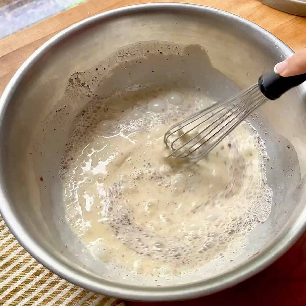 Whisking the brioche French toast custard.