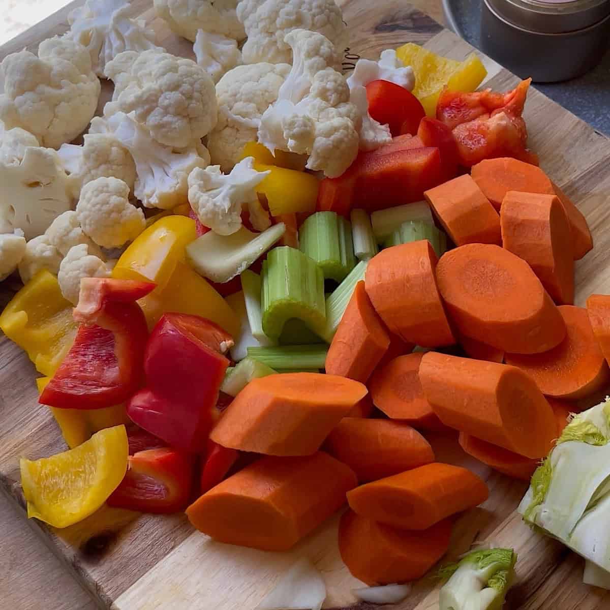 Chopped giardiniera vegetables on a cutting board.