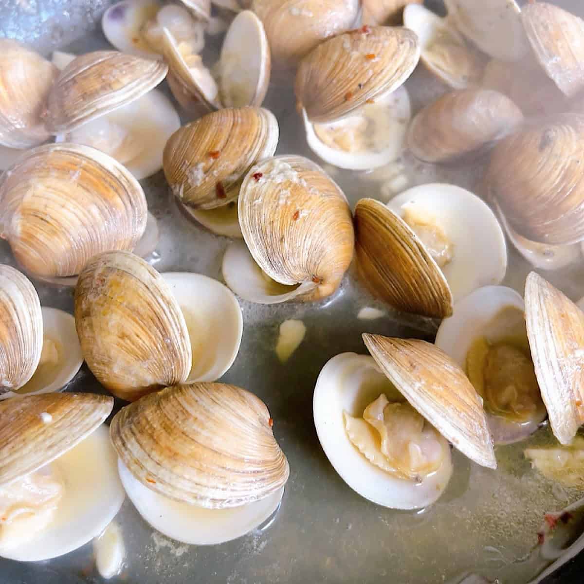 Preparing the clam sauce.