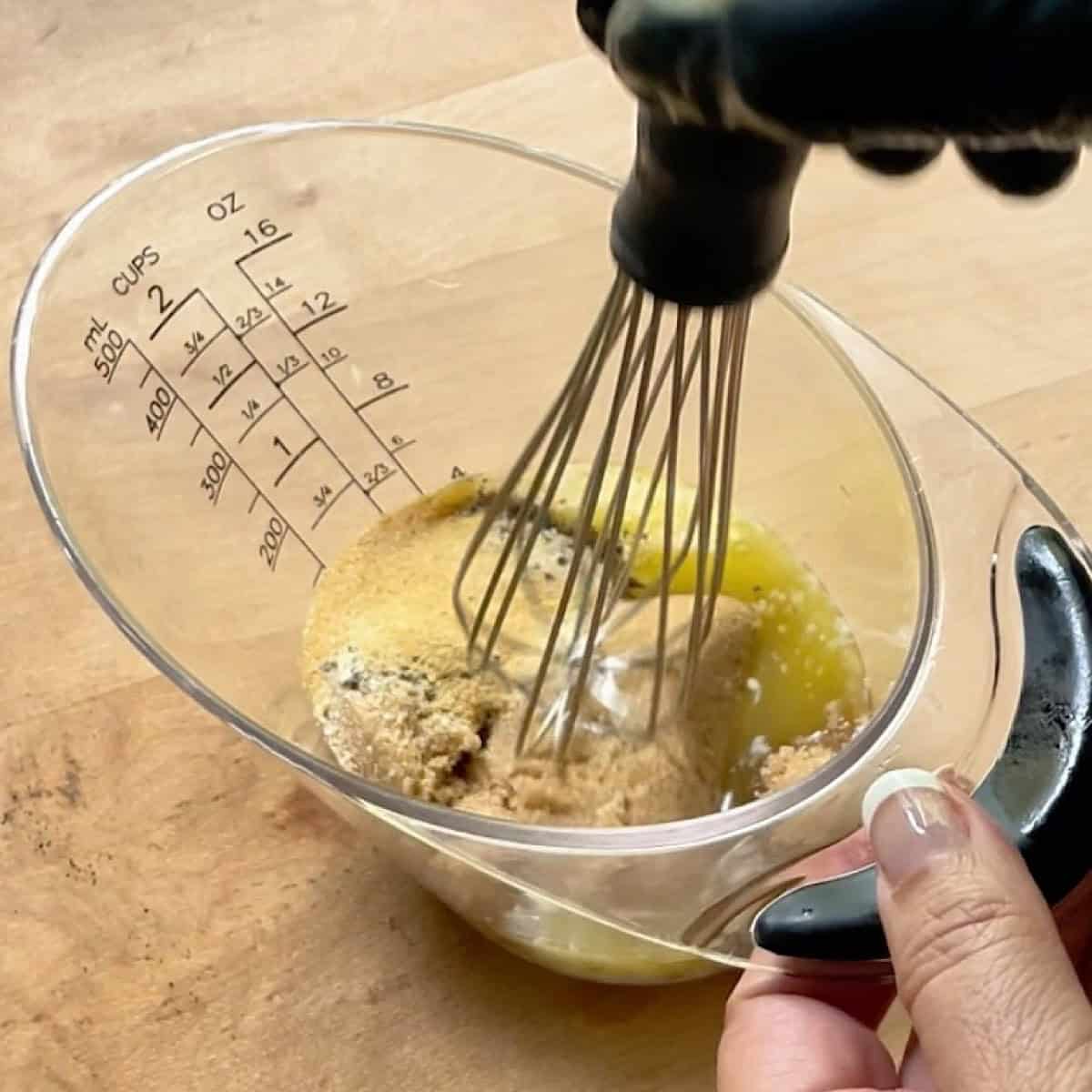 Whisking the glaze ingredients together.