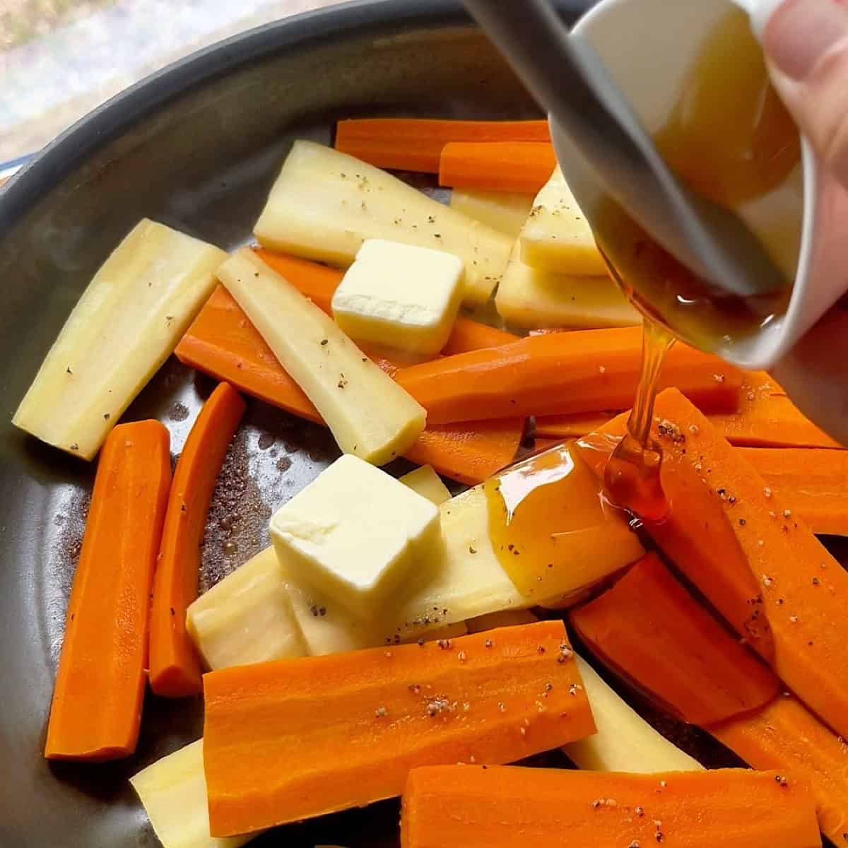 Adding honey and butter to the skillet to make the glaze.
