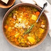 Savory homemade chicken vegetable soup with herbs and spices, perfect for cozy family dinners.