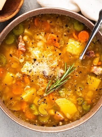 Savory homemade chicken vegetable soup with herbs and spices, perfect for cozy family dinners.