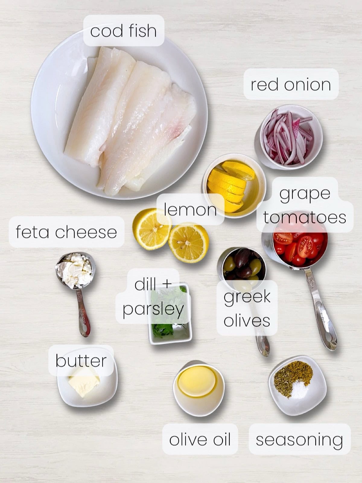 A labeled image of everything needed to make this Mediterranean baked fish recipe.