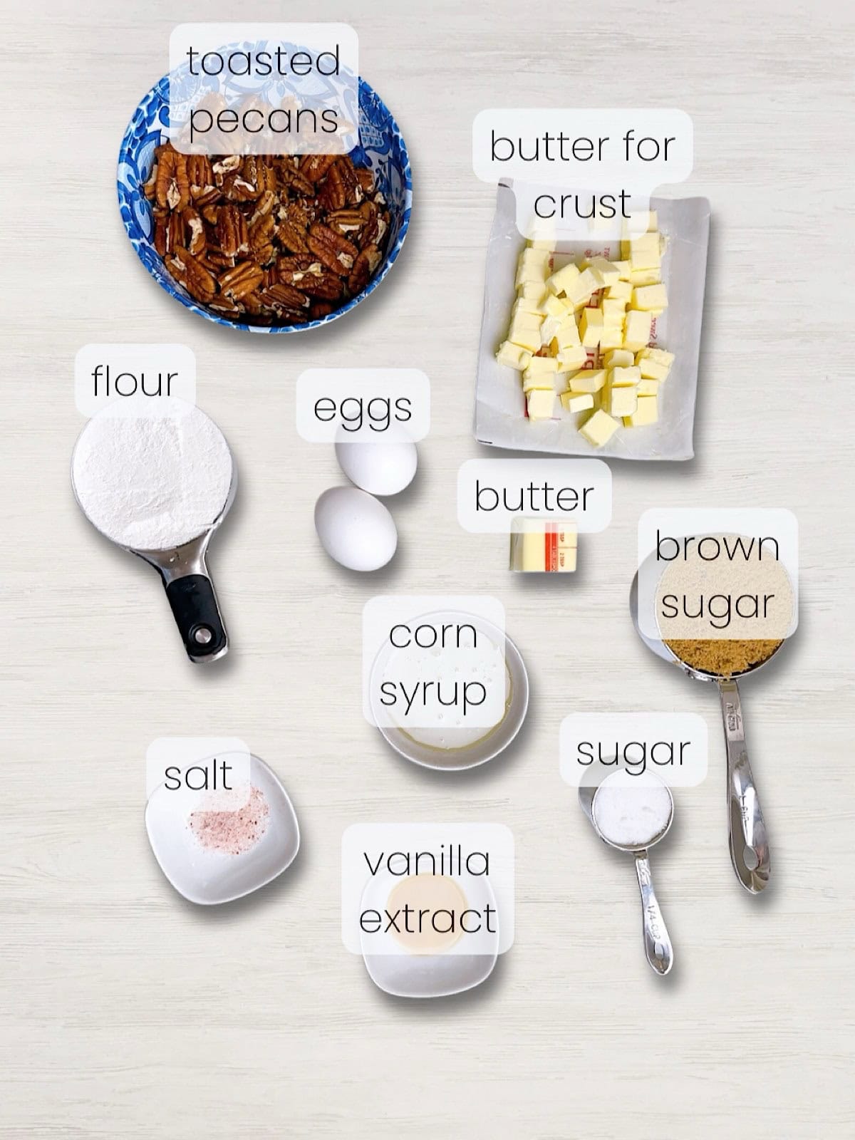 A labeled image of everything needed to make gooey pecan pie bars with shortbread crust.