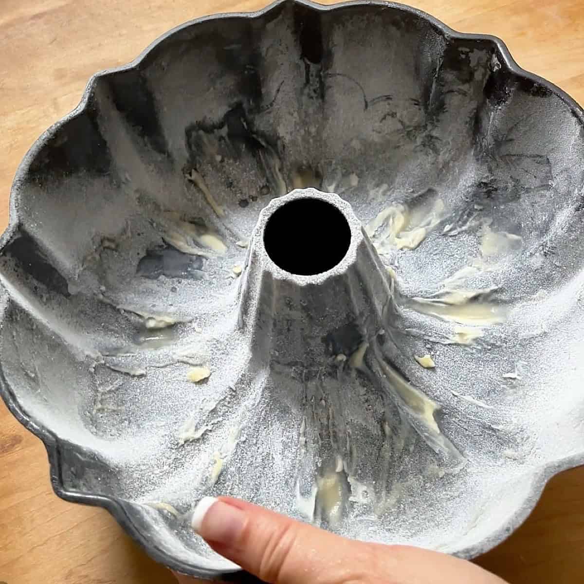 Greased bundt pan with flour.