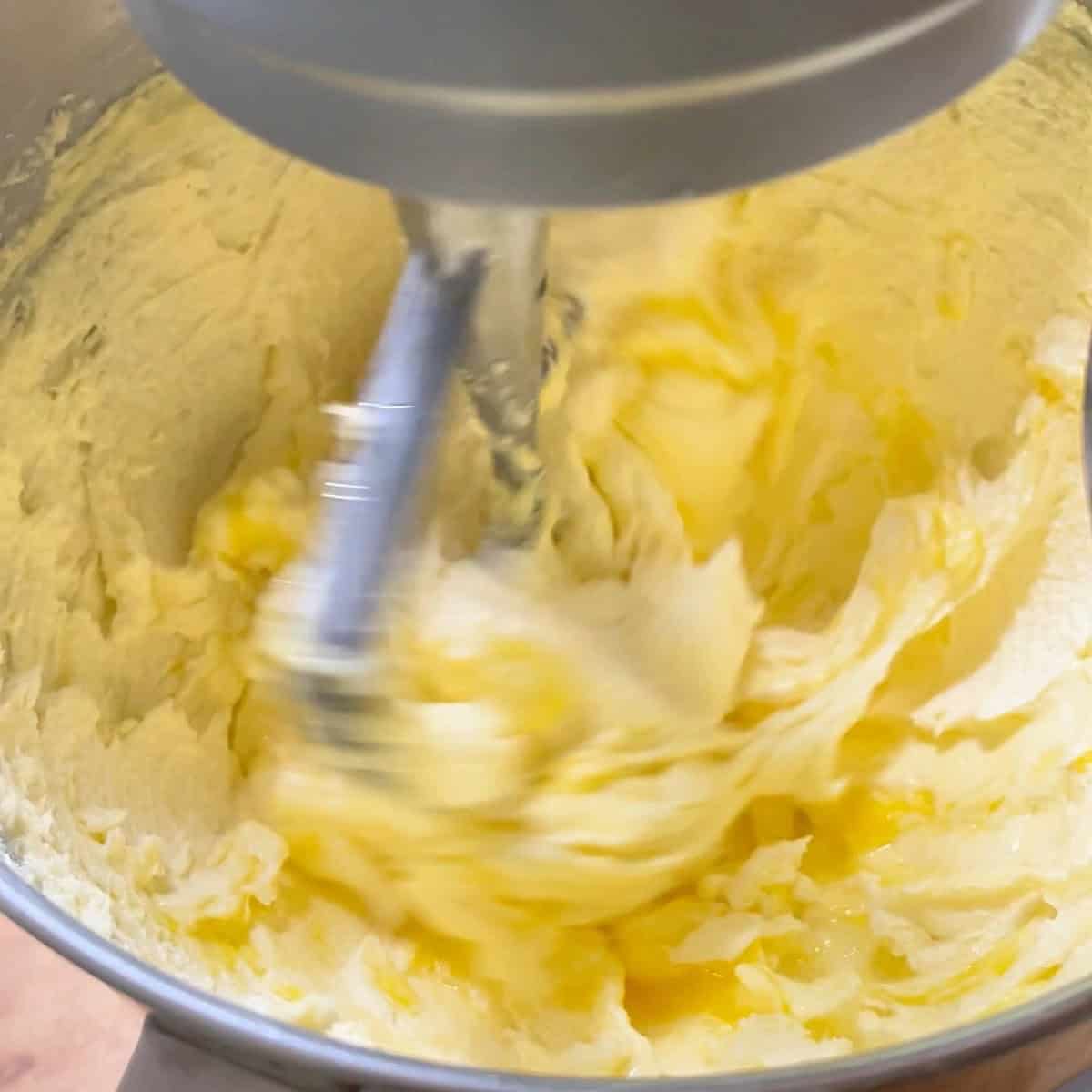 Creaming butter and sugar together in a stand mixer.