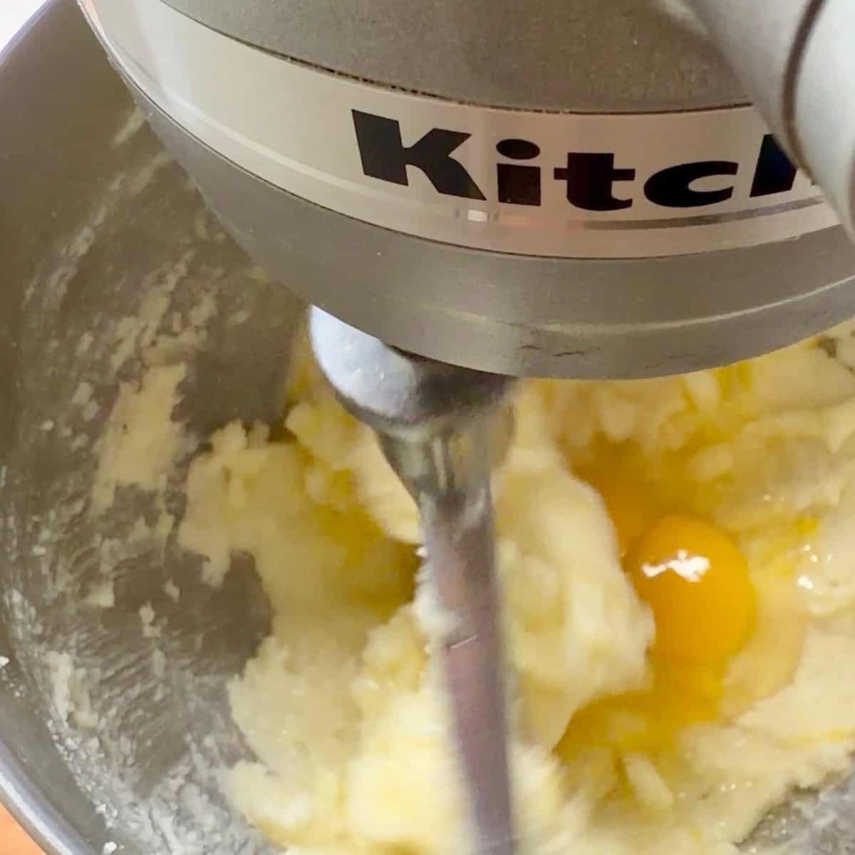 Mixing egg into the wet ingredients.