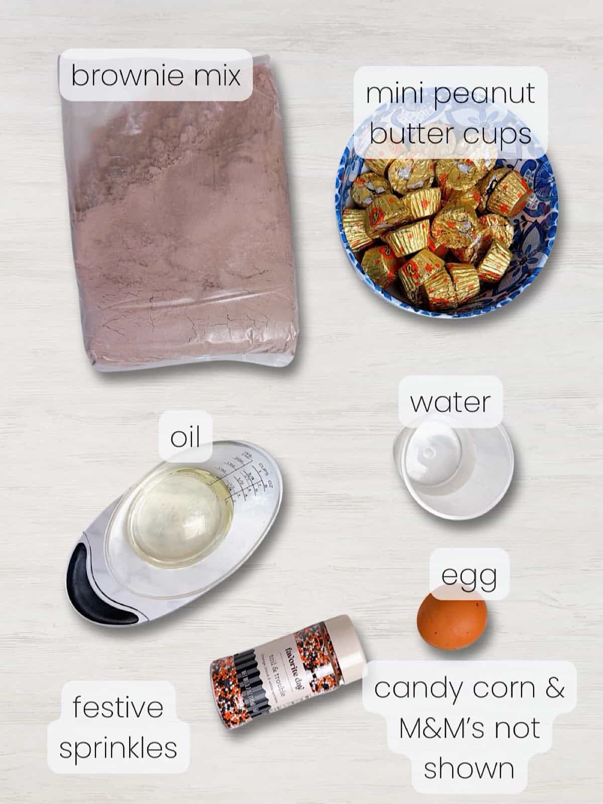 A labeled image of everything needed to make Halloween Brownie Bites.