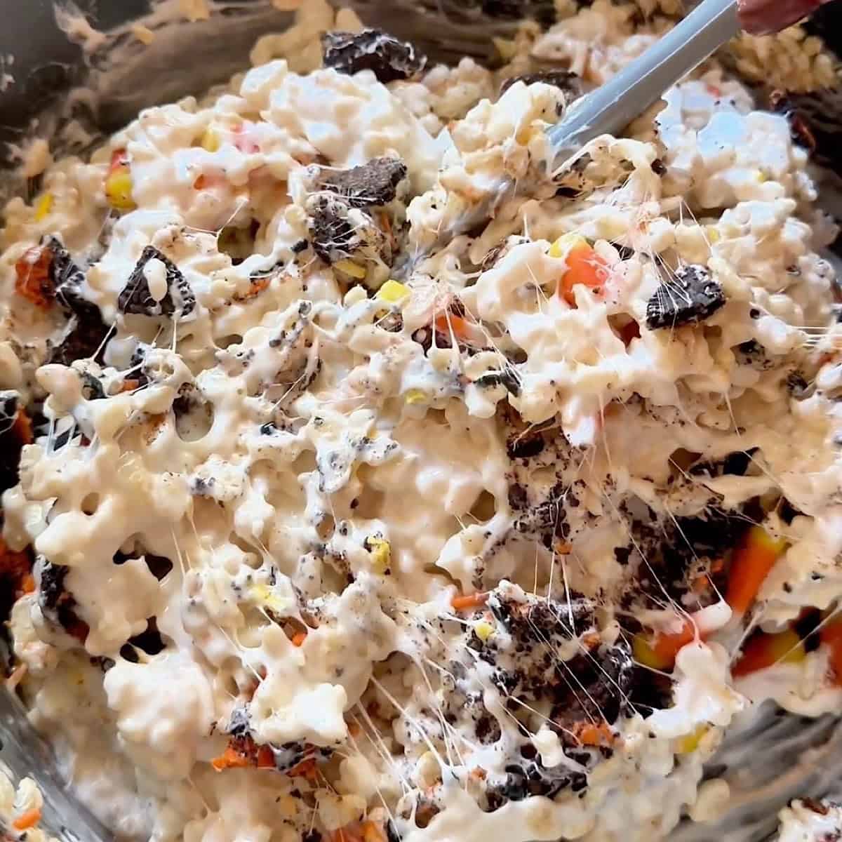 Adding the Halloween candy corn and Oreo cookie chunks.