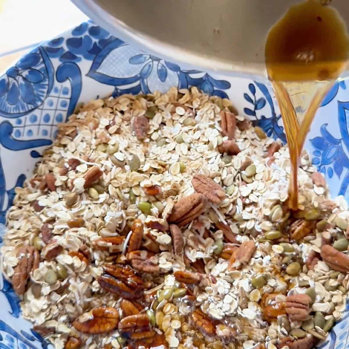 Pouring the warmed maple mixture into the dry ingredients.