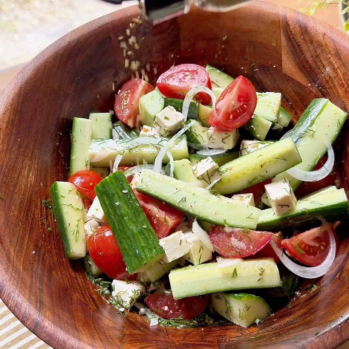 Finished the tossed salad with dried oregano and cracked black pepper.