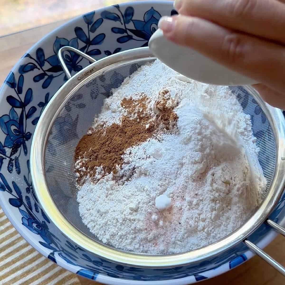 Dry ingredients sifted and whisked into a bowl.