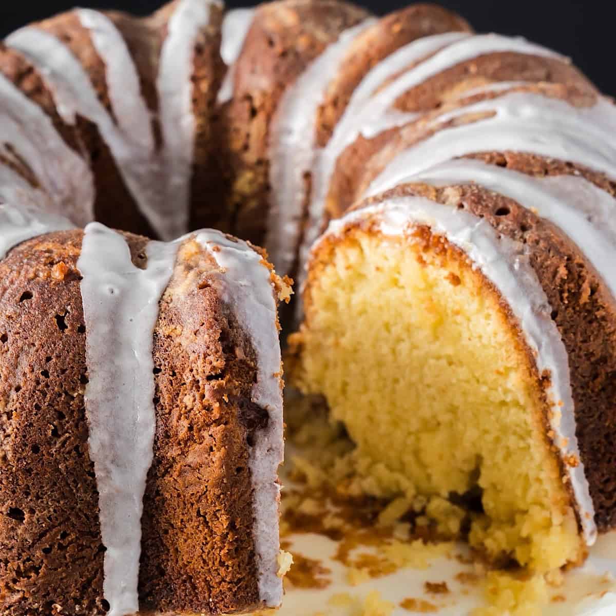 Southern pound cake with a slice removed to show moist crumb.
