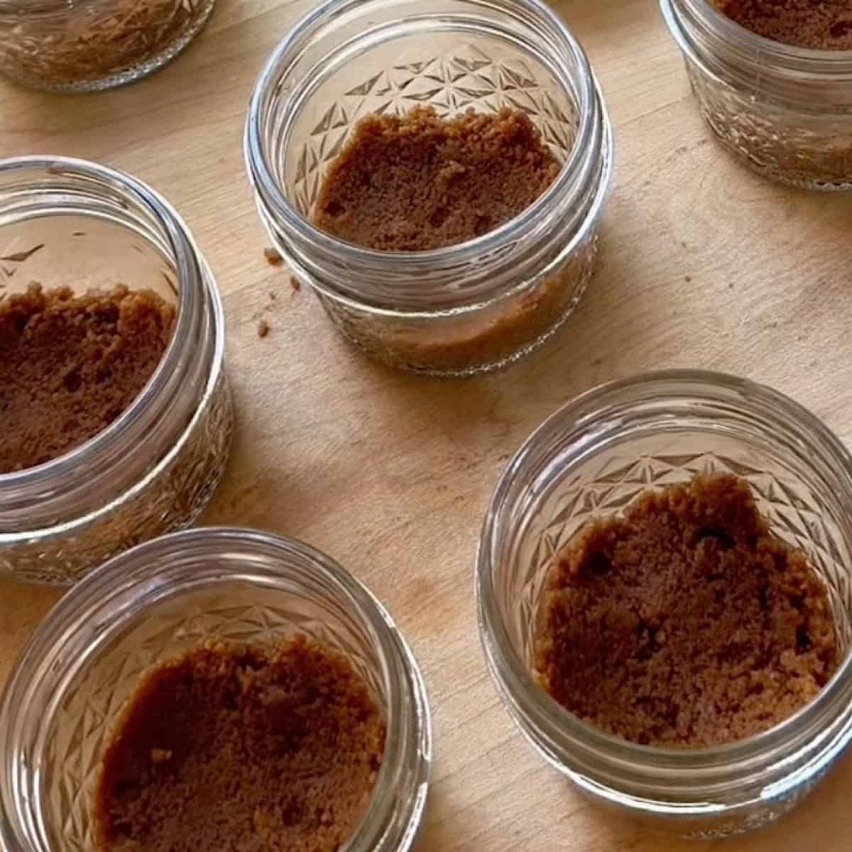 Prepared Biscoff crust in individual jars.