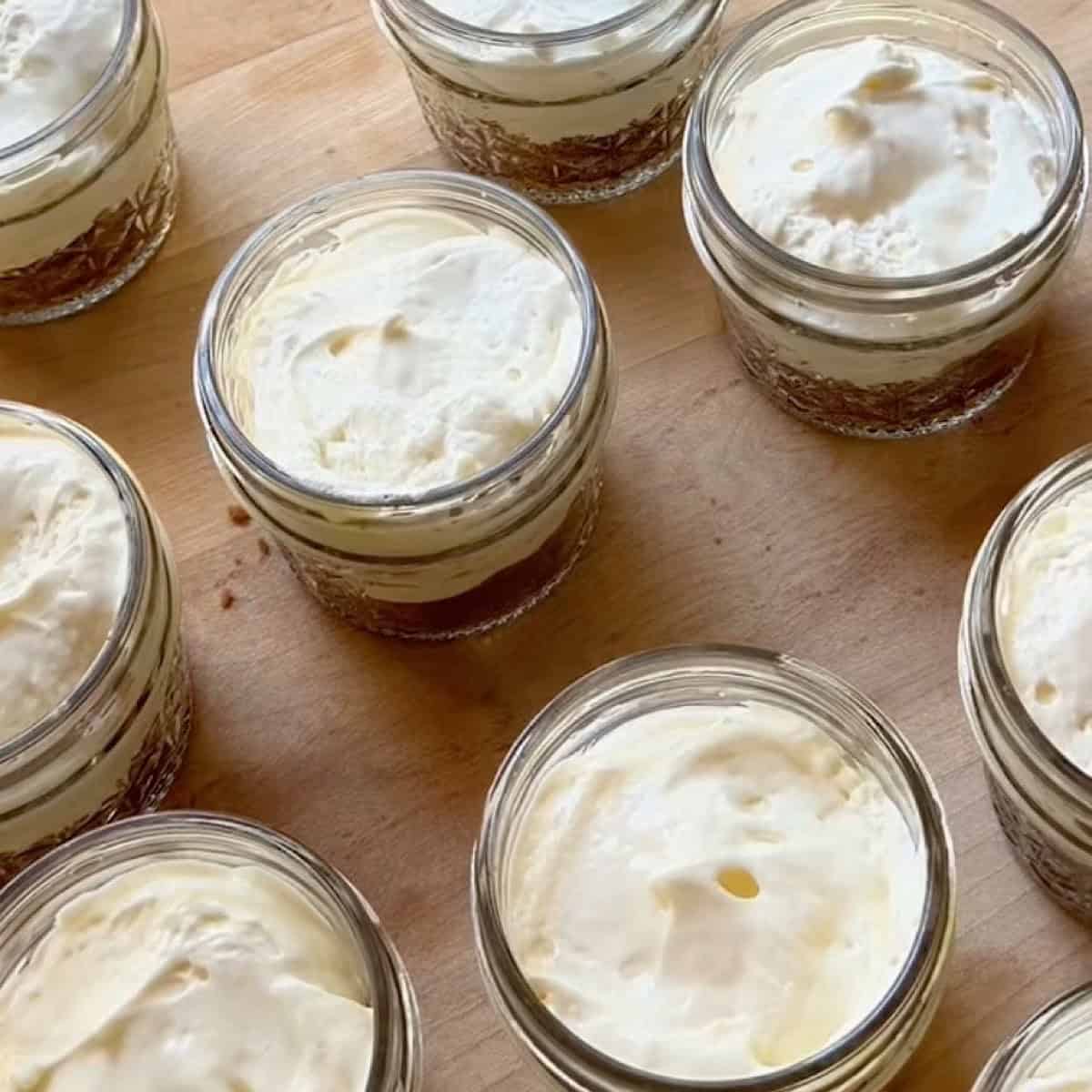 Cheesecake filling smoothed out on top of crust.