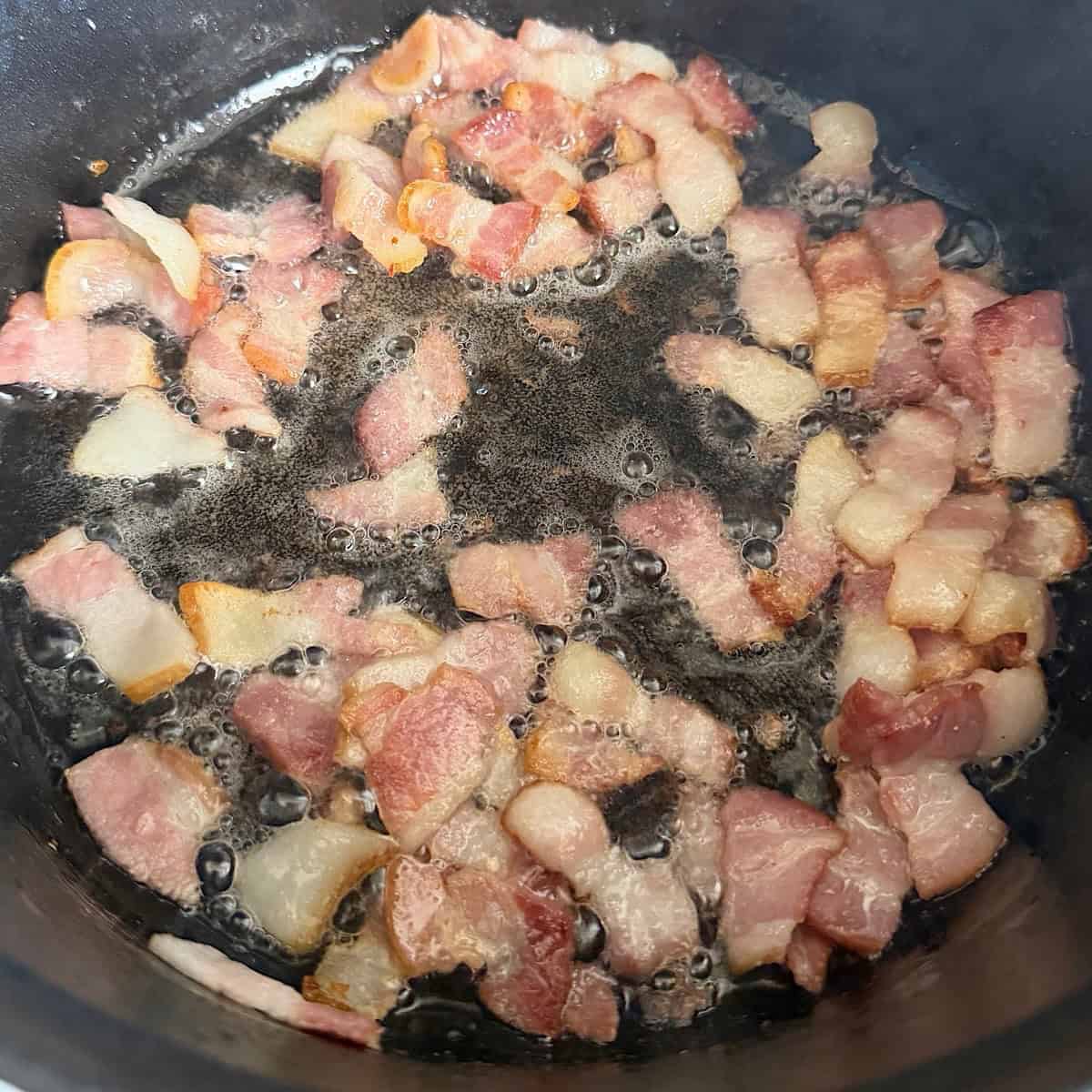 Bacon sizzling in a skillet.
