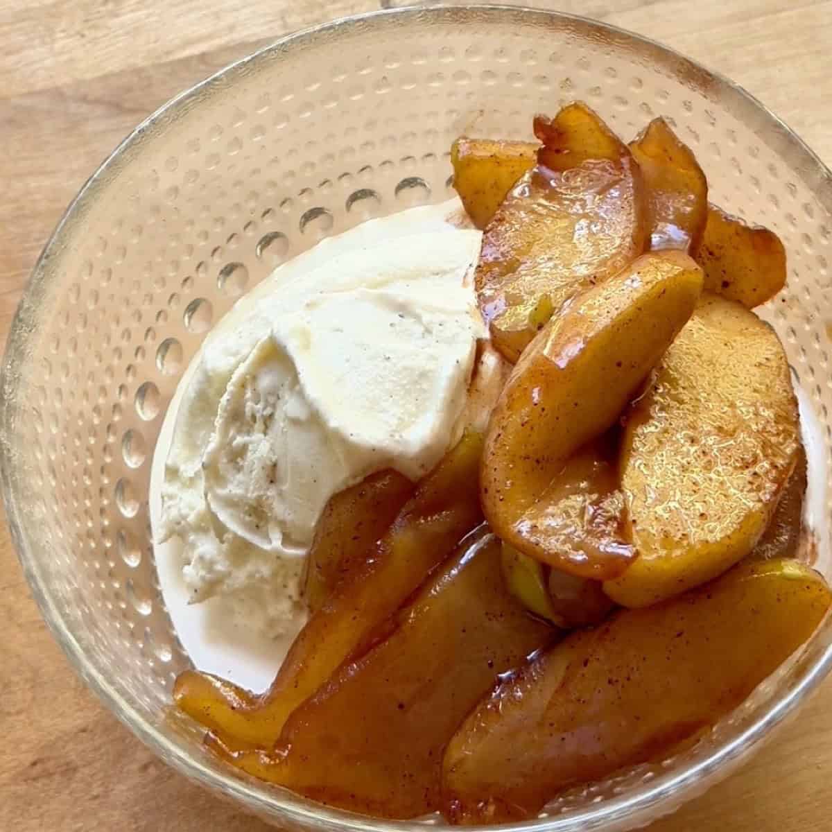 Caramelized apples served over vanilla ice cream.