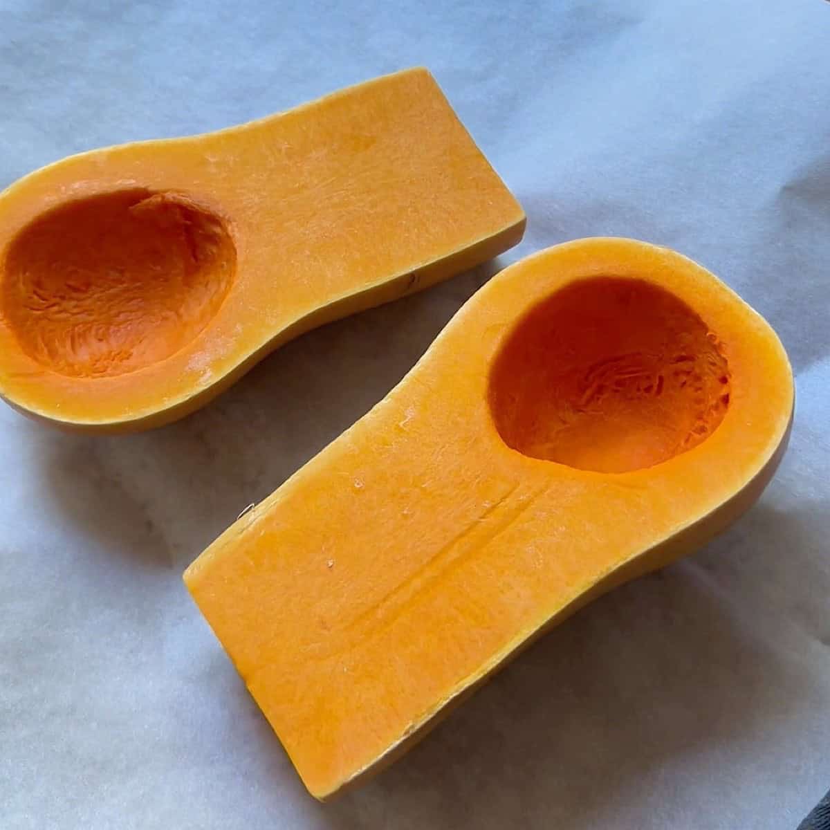 Butternut squash cut open with seeds removed.
