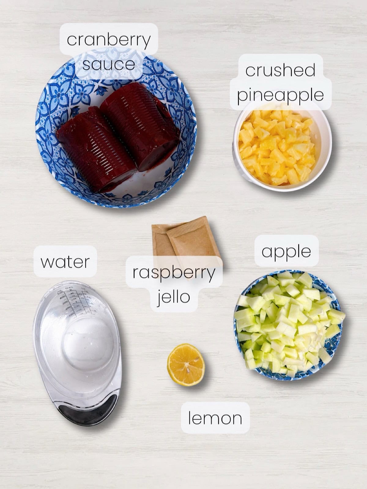 A labeled image of everything needed to make this old fashioned raspberry cranberry jello salad recipe.
