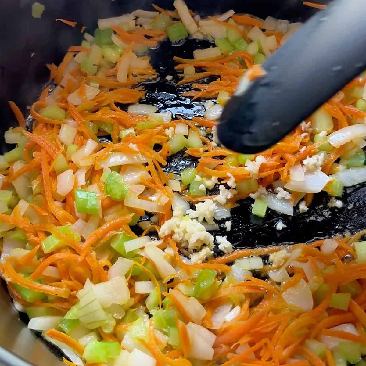 Softening the vegetables in butter.