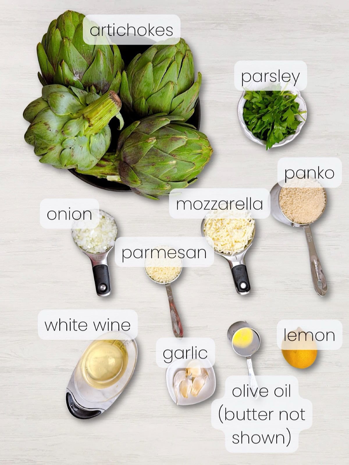 A labeled image of everything needed to make Italian stuffed artichokes.