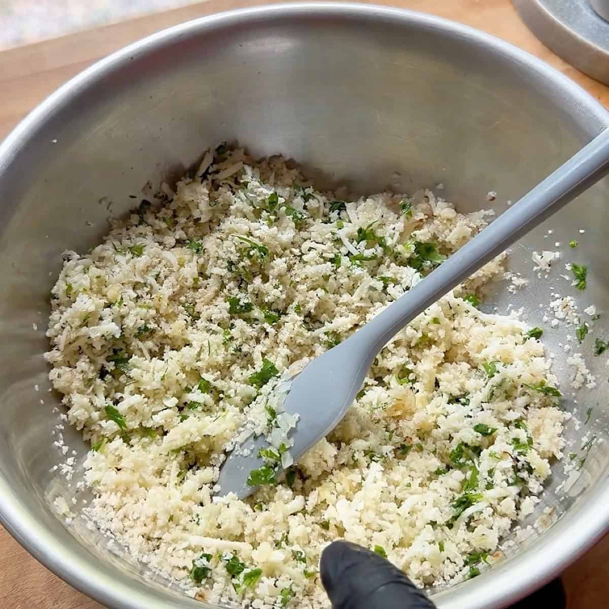Artichoke stuffing mixed in a bowl.