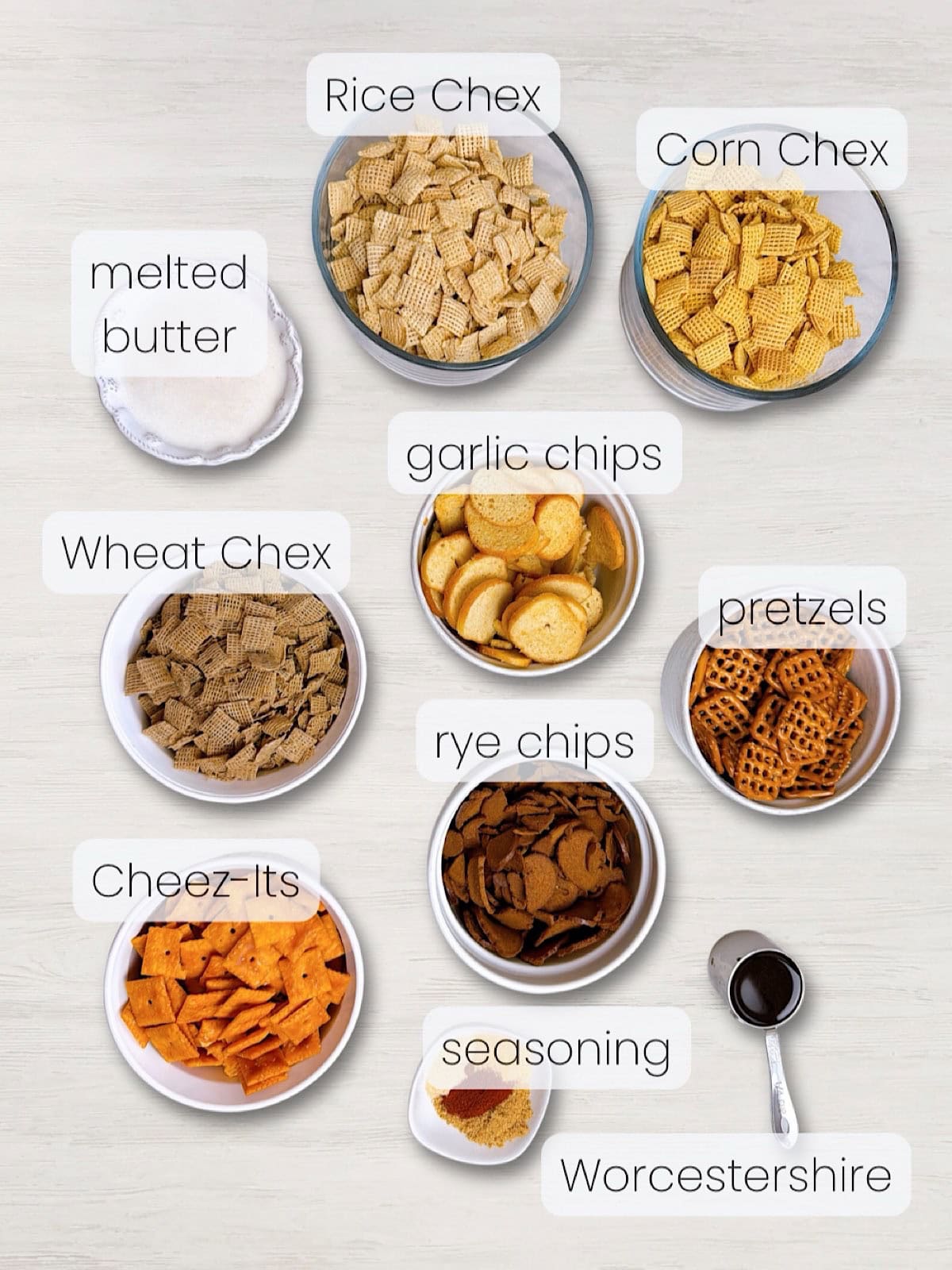 A labeled image of everything needed to make Oven Baked Chex Mix.