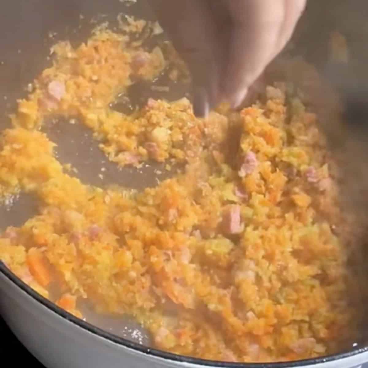 Cooking the pancetta and liquid out of the vegetables.