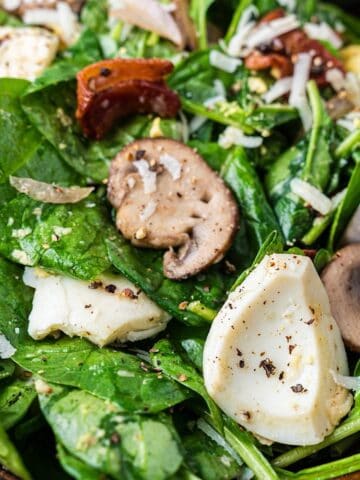 Warm spinach and bacon salad tossed in a bacon vinaigrette.